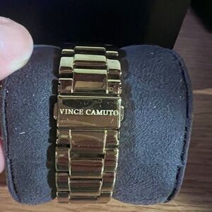 Vince Camuto women’s gold watch.
